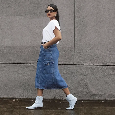 12 looks incríveis de saia midi com bota para todas estações