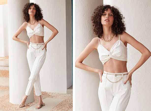 Look branco com calça e top cropped