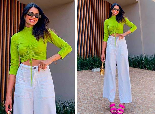 Look com blusa verde neon e calça pantalona branca