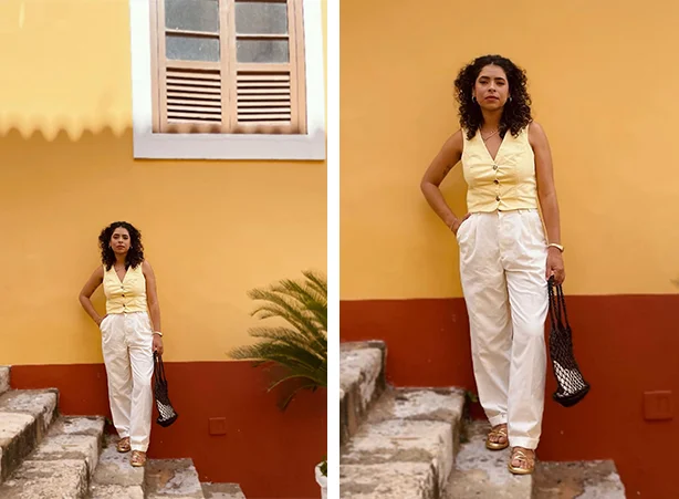 Look feminino com colete e calça branca soltinha