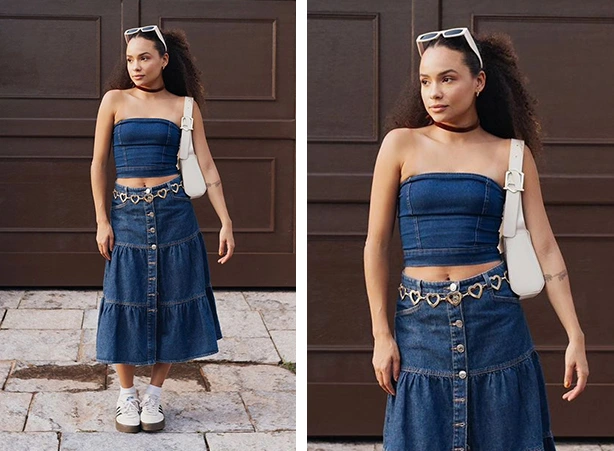 Look todo jeans feminino com cropped corset sem alça e saia midi de camadas