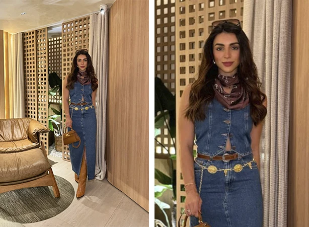 Look com saia jeans longa e colete