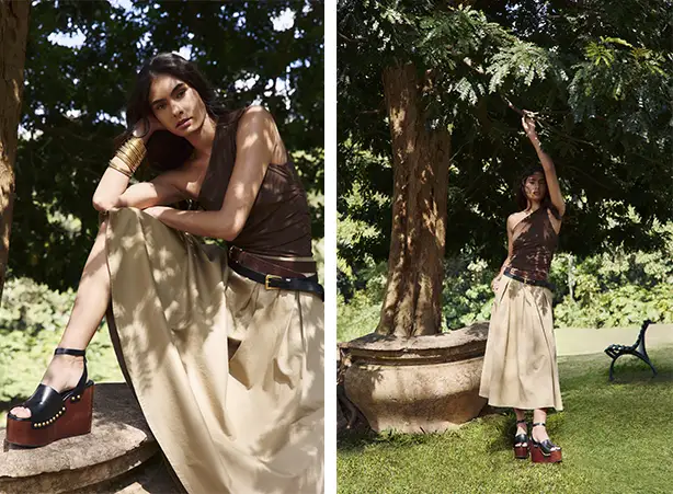 Looks com blusa marrom de ombro único e saia midi bege Looks com blusa marrom de ombro único e saia midi bege